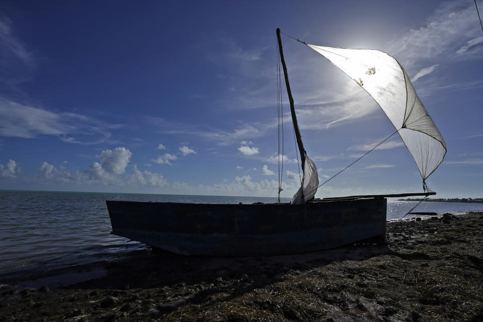 A recently arrived rustic migrant boat sits on the shore, Wednesday, Jan. 4, 2023, in Islamorada, Fla. More than 500 Cuban immigrants have come ashore in the Florida Keys since the weekend, the latest in a large and increasing number who are fleeing the communist island. (AP Photo/Wilfredo Lee)