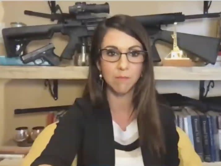Rep. Lauren Boebert displays her guns during a Zoom meeting with the House Natural Resources Committee  (Screengrab via Twitter)