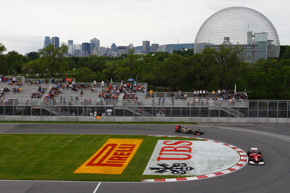 MONTREAL, CANADA - JUNE 08: Fernando Alonso of Spain and Ferrari drives ahead of Kimi Raikkonen of Finland and Lotus during practice for the Canadian Formula One Grand Prix at the Circuit Gilles Villeneuve on June 8, 2012 in Montreal, Canada. (Photo by Paul Gilham/Getty Images)