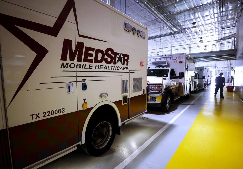 Ambulances at MedStar headquarters in Fort Worth prepare to be dispatched in May 2022.
