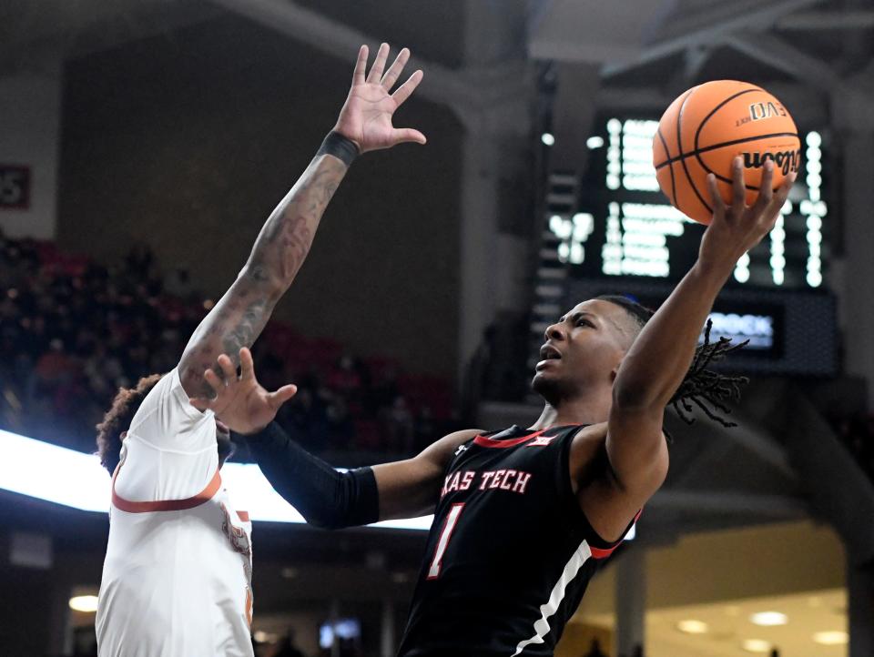 Texas Tech's guard Lamar Washington (1) prepares to shoot the ball against Texas in a Big 12 basketball game, Monday, Feb. 13, 2023, at the United Supermarkets Arena. 