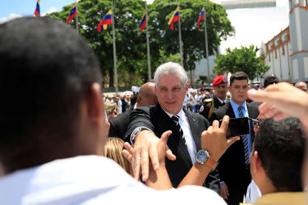 FILE PHOTO: Cuba's President Miguel Diaz-Canel attends a ceremony at the National Pantheon in Caracas, Venezuela May 30, 2018. REUTERS/Marco Bello/File Photo
