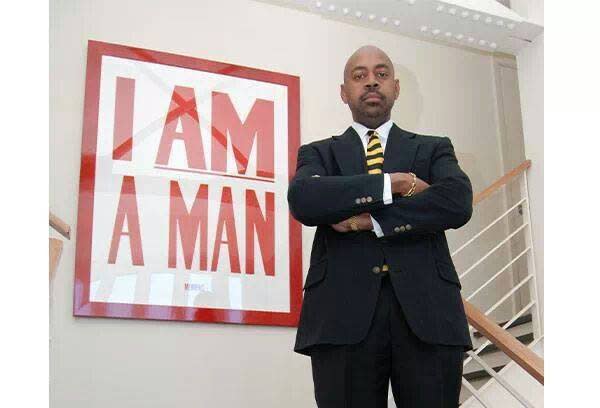 Attorney Ricky Wilkins poses by the iconic 'I Am A Man' phrase. Wilkins, a prominent civic figure and attorney in Memphis, died Thursday at 58 years old.
