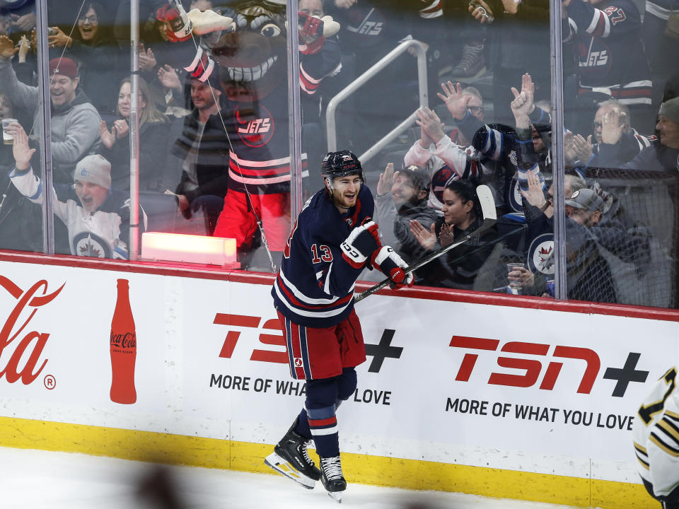 Winnipeg Jets' Gabriel Vilardi (13) celebrates his goal on Boston Bruins goaltender Jeremy Swayman during the second period of an NHL hockey game Friday, Dec. 22, 2023, in Winnipeg, Manitoba. (John Woods/The Canadian Press via AP)