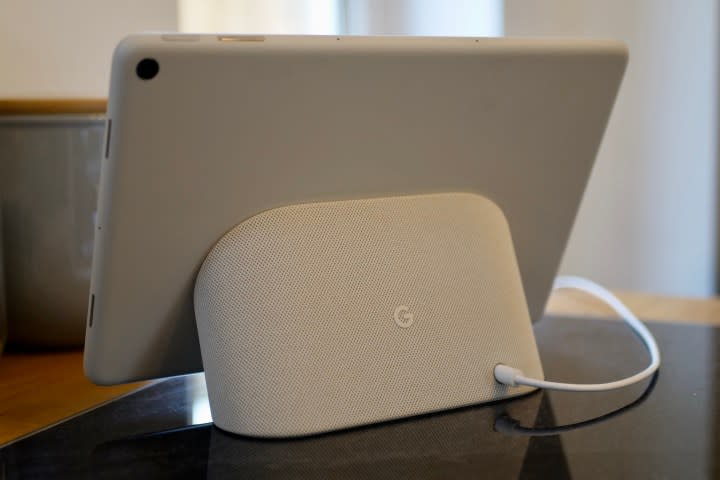 The Google Pixel Tablet on its stand, showing the speaker section.