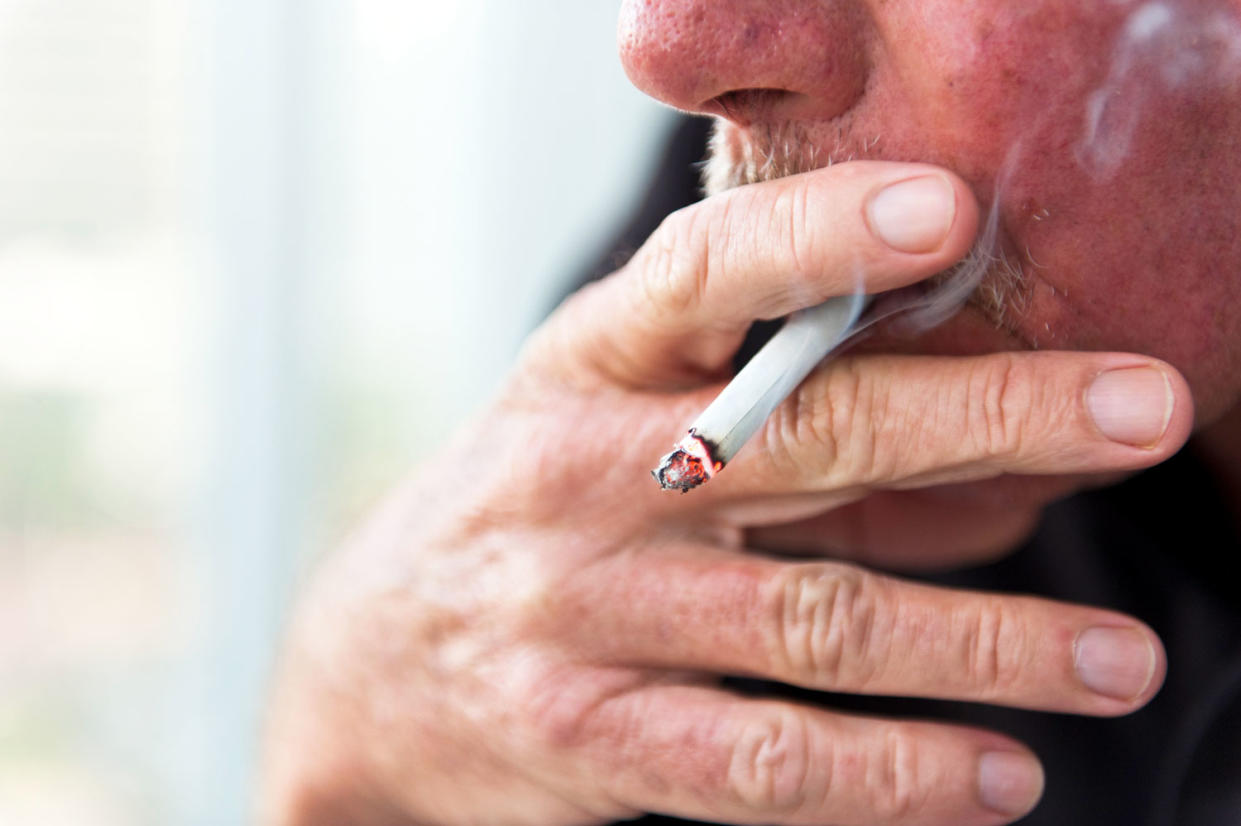 Smoking can lead to COPD, an umbrella term used to describe a group of lung diseases that block airflow and make it hard to breathe. (Photo: Getty Images)