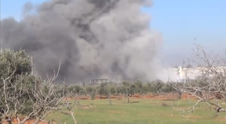 Heavy smoke rises from a location said to be a Medecins Sans Frontieres (MSF) supported hospital in Marat al Numan, Idlib, Syria, February 15, 2016 in this still image taken from a video on a social media website. REUTERS/Social Media Website via Reuters TV