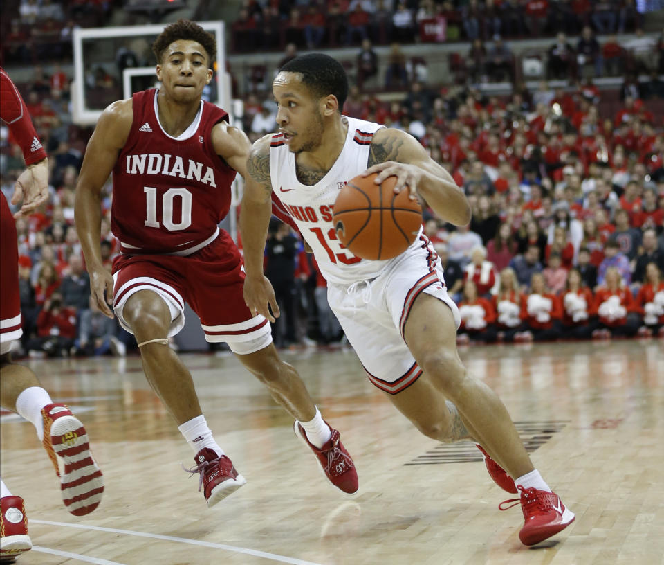 Ohio State's C.J. Walker, right, dribbles past Indiana's Rob Phinisee during the second half of an NCAA college basketball game Saturday, Feb. 1, 2020, in Columbus, Ohio. Ohio State beat Indiana 68-59. (AP Photo/Jay LaPrete)