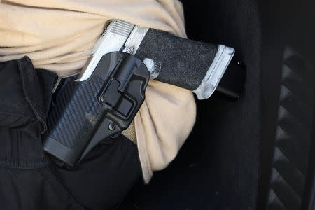 C.J. Grisham, founder of Open Carry Texas, openly carries a firearm in Houston, Texas, U.S., September 24, 2018. Picture taken September 24, 2018. REUTERS/Loren Elliott