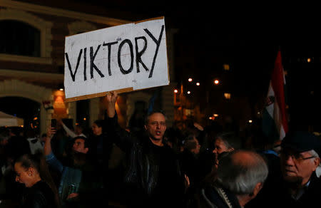 Supporters of Fidesz party react to the preliminary results of parliamentary election in Budapest, Hungary, April 8, 2018. REUTERS/Leonhard Foeger