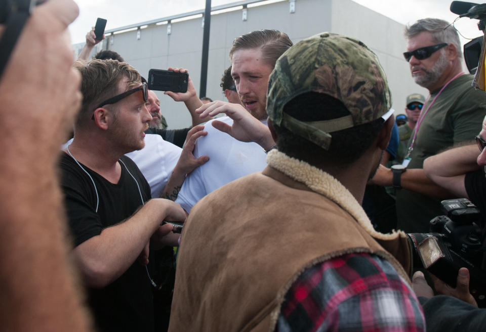 A man leaving the Richard Spencer event is accosted by people waiting outside.