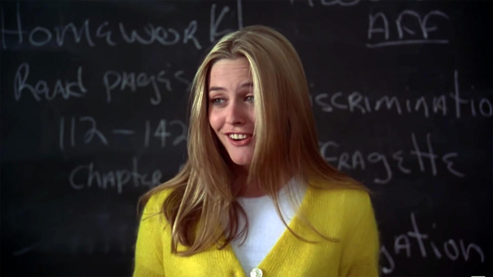 Alicia Silverstone as Cher in Clueless, talking to her class from the front of the room