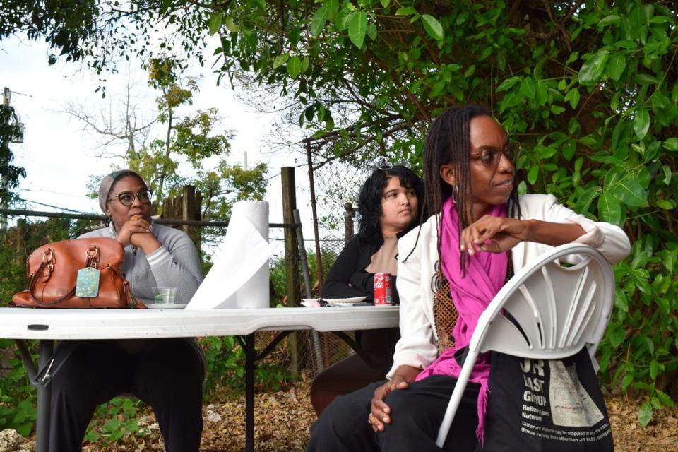 Solamia Ortiz, center, and other women listen to the testimonial of their fellow cohort member.