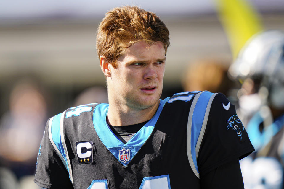 Carolina Panthers quarterback Sam Darnold looks on before an NFL football game between the Carolina Panthers and the New England Patriots Sunday, Nov. 7, 2021, in Charlotte, N.C. (AP Photo/Jacob Kupferman)