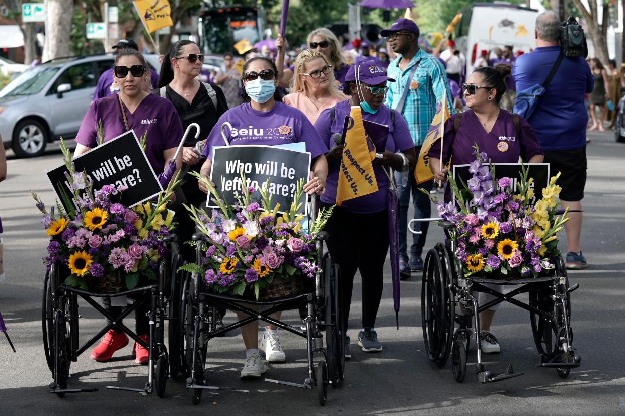 Nursing home workers, home care workers and supporters march through the streets of California's capital in June to advocate for higher industry standards, safer staffing levels and increased wages.