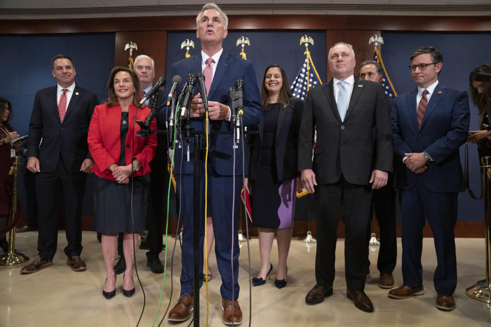 FILE - House Minority Leader Kevin McCarthy, of Calif., speaks during a news conference with members of the House Republican leadership, Nov. 15, 2022, after voting on top House Republican leadership positions, on Capitol Hill in Washington. Rep. Elise Stefanik, R-N.Y., and Rep. Steve Scalise, R-La., are at right. (AP Photo/Jacquelyn Martin, File)
