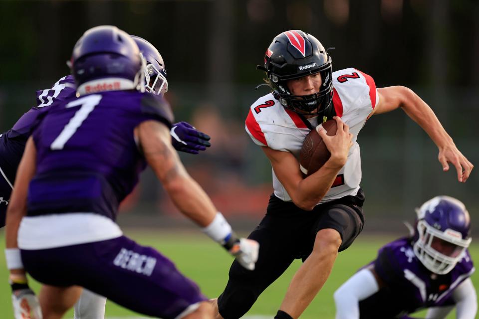 Creekside's Sean Ashenfelder (2) rushes for yards during the second quarter of the Aug. 18 kickoff classic against Fletcher.