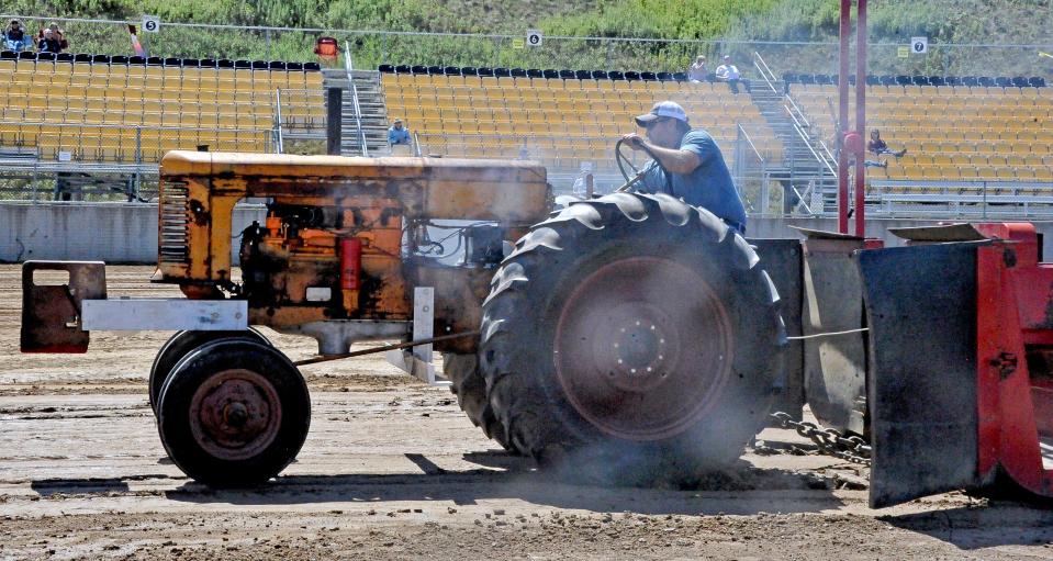 Jason Schuch participates in the antique tractor pull at the 2022 Holmes County Fair.