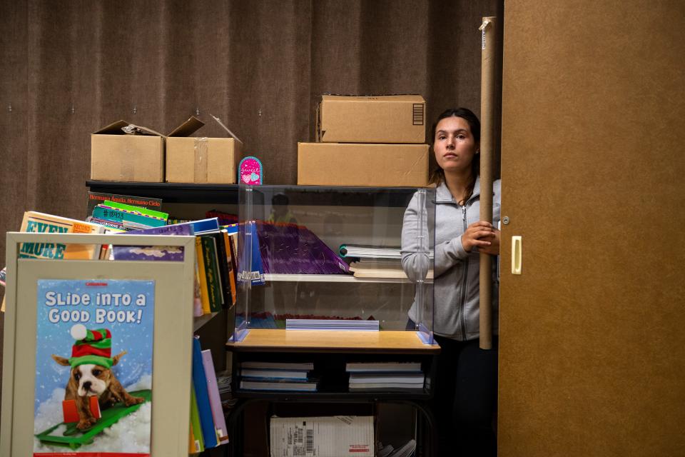 An employee at Alisal Union School District hides behind school supplies and furniture during an active shooter training at Virginia Rocca Barton School in Salinas, Calif., on Thursday, June 9, 2022. 