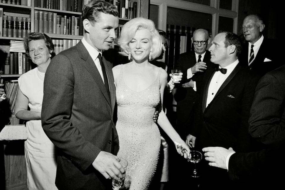 Mandatory Credit: Photo by Cecil Stoughton/AP/Shutterstock (9290356b) Provided by the John F. Kennedy Presidential Library and Museum, actress Marilyn Monroe wears the iconic gown that she wore while singing "Happy Birthday" to President John F. Kennedy at Madison Square Garden, during a reception in New York City. Standing next to Monroe is Steve Smith, President Kennedy's brother-in-law. Julien's Auctions will offer Monroe's gown at auction in Los Angeles on Nov. 17, 2016 Marilyn Dress Auction, New York, USA - 19 May 1962