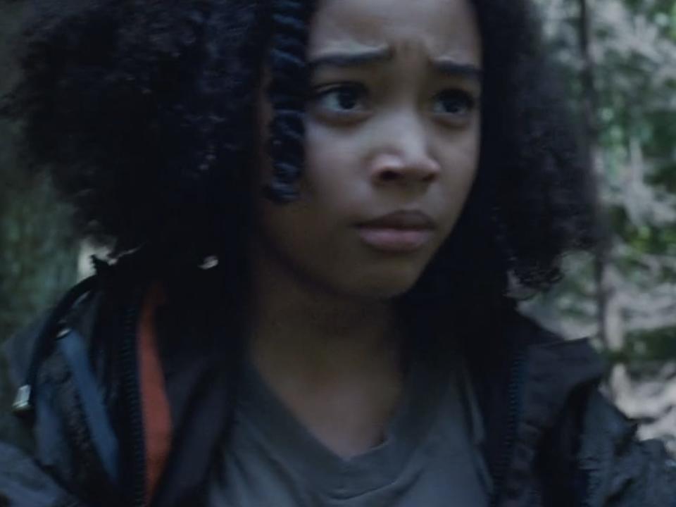 rue looking worriedly past katniss in the hunger games