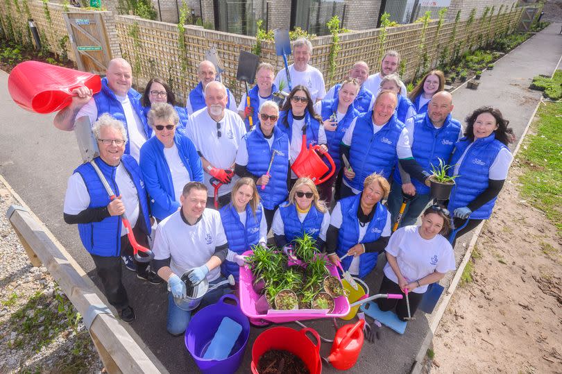 Lottery winners from across the UK help out with gardening at Alder Hey Children's Hospital (Anthony Devlin/PA)