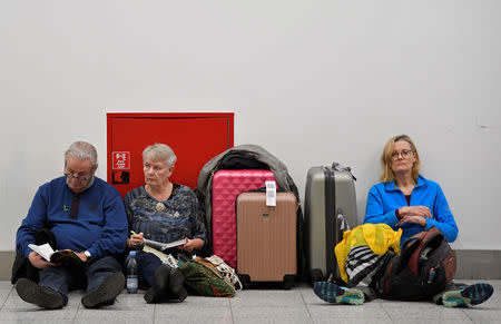 Passengers wait in the South Terminal building at Gatwick Airport, after the airport reopened to flights following its forced closure because of drone activity, in Gatwick, Britain, December 21, 2018. REUTERS/Toby Melville