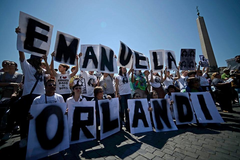 Demonstrators hold letters reading Emanuela Orlandi’s name during a 2012 protest (AFP via Getty Images)