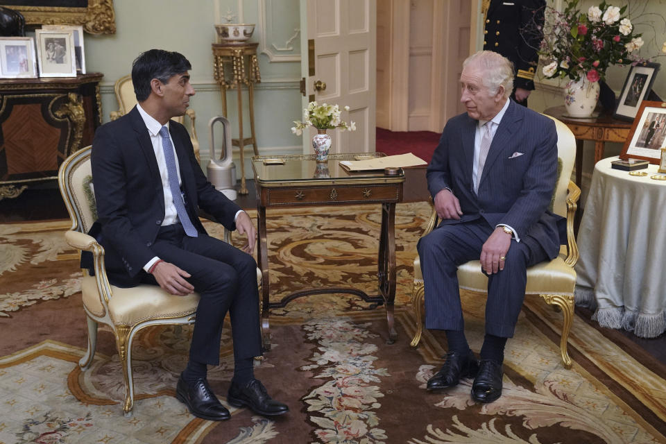 King Charles III, and Britain's Prime Minister Rishi Sunak talk during their meeting at Buckingham Palace, London, Wednesday, Feb. 21, 2024. (Jonathan Brady/Pool Photo via AP)