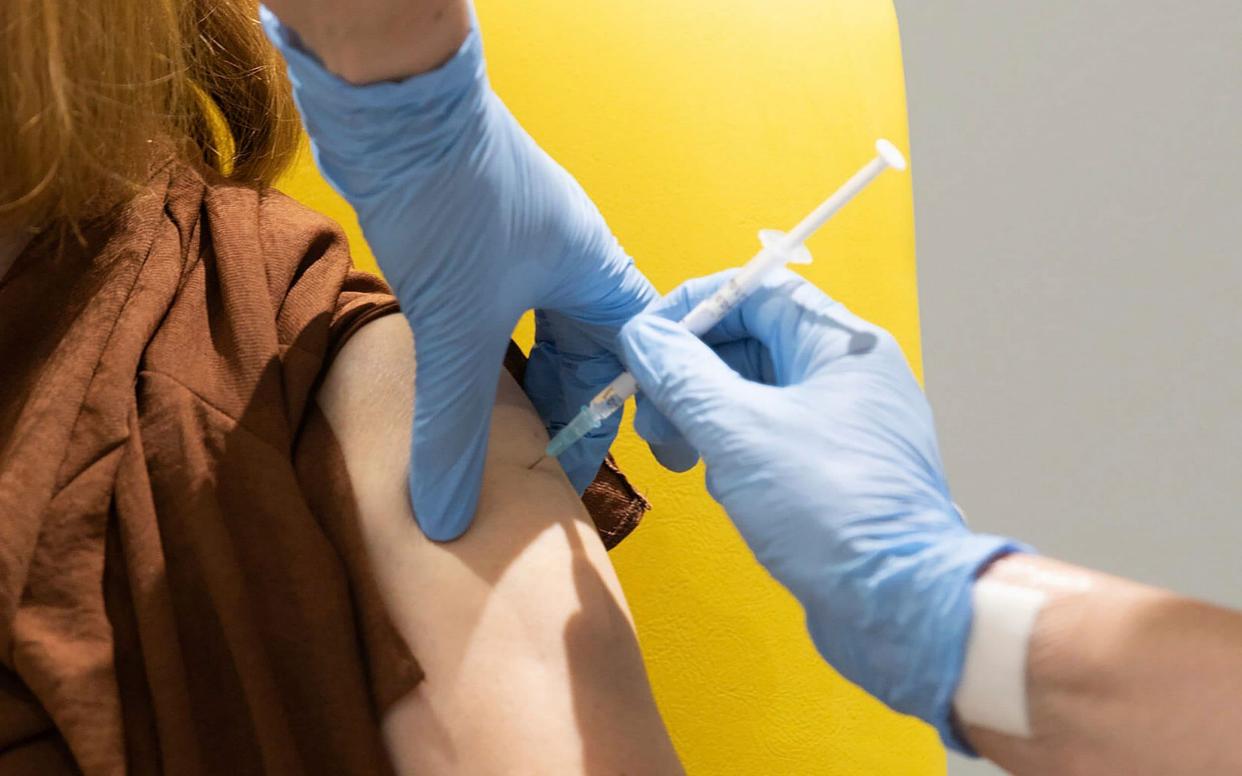 A volunteer is administered the coronavirus vaccine developed by AstraZeneca and Oxford University, in Oxford - University of Oxford