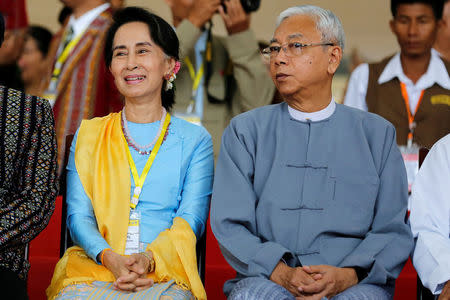 FILE PHOTO- Myanmar State Counsellor Aung San Suu Kyi (L) and Myanmar's president Htin Kyaw attend a photo opportunity after the opening ceremony of the 21st Century Panglong Conference in Naypyitaw, Myanmar May 24, 2017. REUTERS/Soe Zeya Tun/File Photo