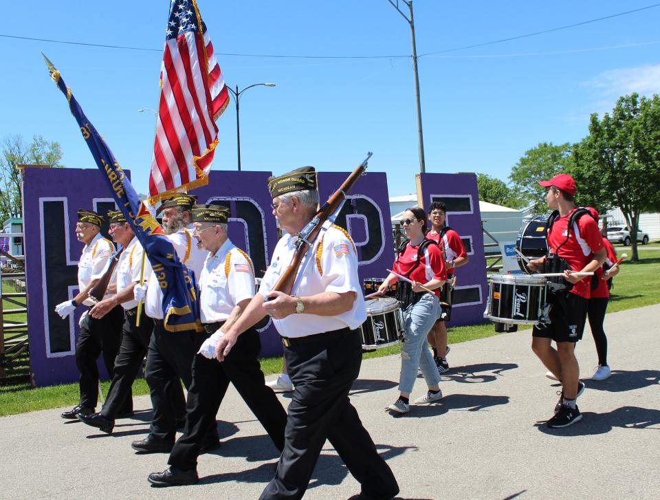 Members of the Honor Guard at Monroe Post No. 1138, Veterans of Foreign Wars and Monroe High School drumline led cancer survivors as they walked their annual victory lap at the Relay for Life for Monroe County.