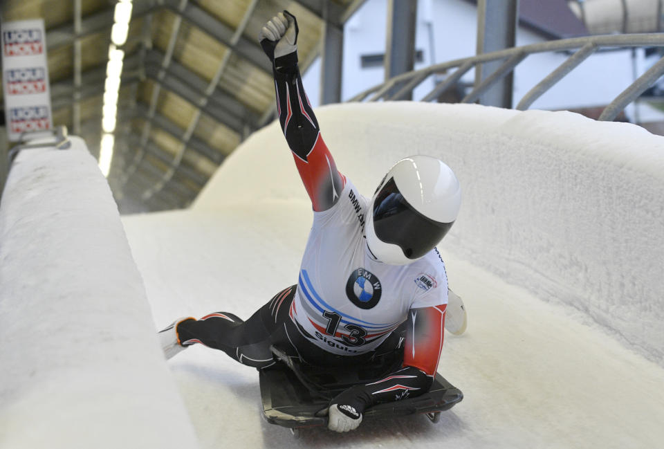 Elisabeth Maier of Canada reacts on finish after she placed second of the women's skeleton World Cup race in Sigulda, Latvia, Sunday, Dec. 9, 2018. (AP Photo/Roman Koksarov)