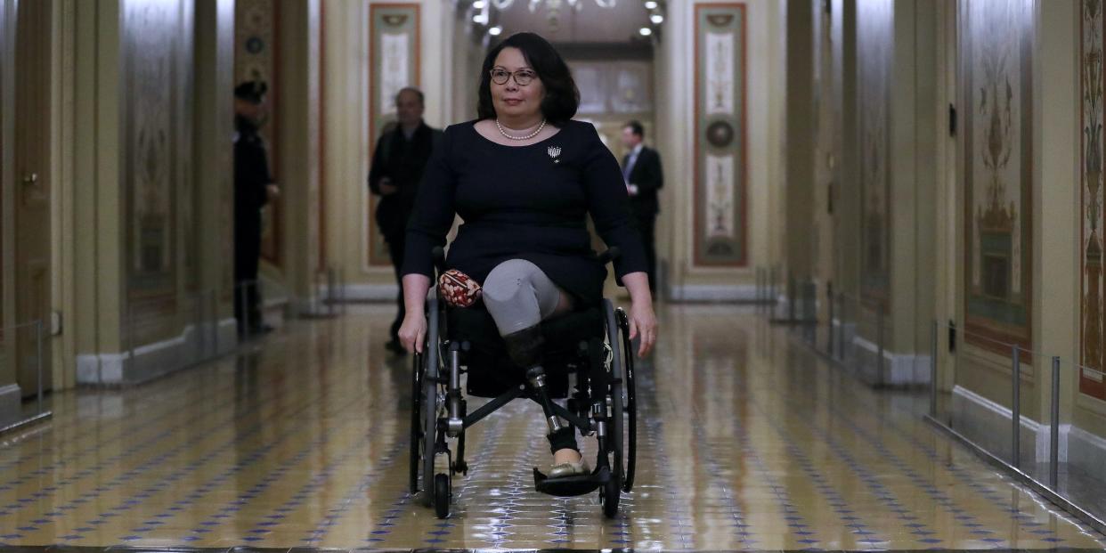 Senator Tammy Duckworth moves through the halls of the US Senate.