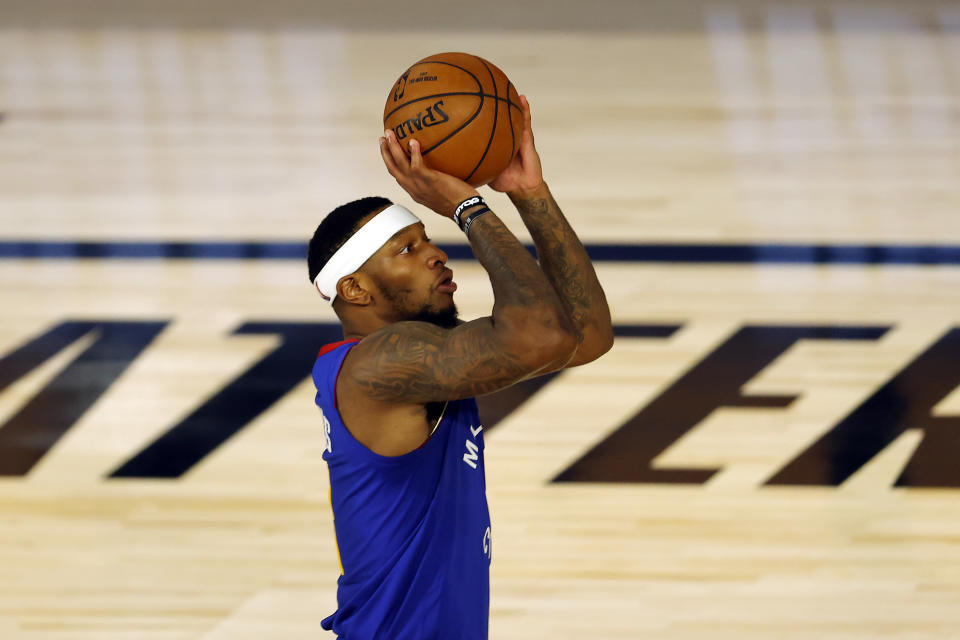 Denver Nuggets' Torrey Craig shoots against the Miami Heat during an NBA basketball game, Saturday, Aug. 1, 2020, in Lake Buena Vista, Fla. (Kevin C. Cox/Pool Photo via AP)