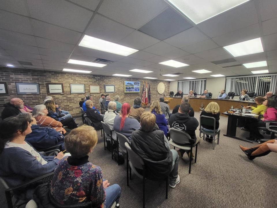 Algonac City Council members and a full audience watch on during a presentation about the old elementary school at the center of town on Tuesday, March 5, 2024. The city, which purchased the school in late 2023, is weighing ideas to redevelop it and determine a path forward.