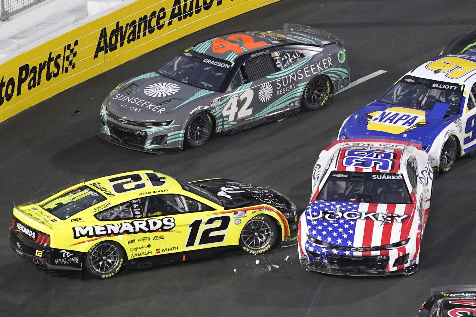 NASCAR Cup Series driver Ryan Blaney (12) spins out and is hit by Daniel Suarez (99) during the Busch Light Clash NASCAR exhibition auto race at Los Angeles Memorial Coliseum Sunday, Feb. 5, 2023, in Los Angeles. (AP Photo/Mark J. Terrill)