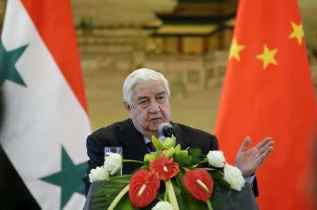 Syria's Foreign Minister Walid al-Moualem speaks during a joint news conference with China's Foreign Minister Wang Yi (not seen) after a meeting at the Ministry of Foreign Affairs in Beijing, China, December 24, 2015. REUTERS/Jason Lee/Files