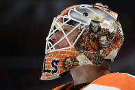 Philadelphia Flyers goaltender Brian Elliott pauses during a break in the action in the second period of the team's NHL hockey game against the Washington Capitals, Wednesday, March 4, 2020, in Washington. The Flyers won 5-2. (AP Photo/Nick Wass)