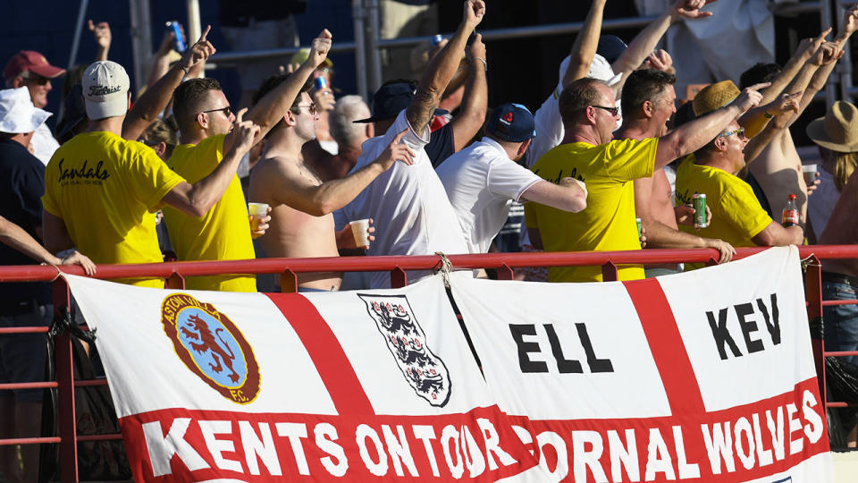 England supporters cheer in St Lucia. (Photo by Randy Brooks / AFP)