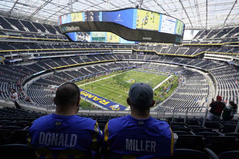 Los Angeles Rams fans wait prior to an NFL football game between the San Francisco 49ers and the Rams Sunday, Oct. 30, 2022, in Inglewood, Calif. (AP Photo/Gregory Bull)