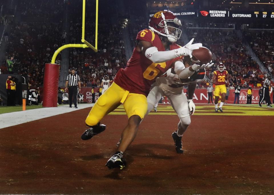 USC cornerback Isaac Taylor-Stuart intercepts a pass intended for Oregon State's Trevon Bradford.