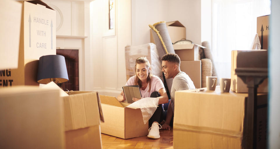 Young couple moving in to their new house