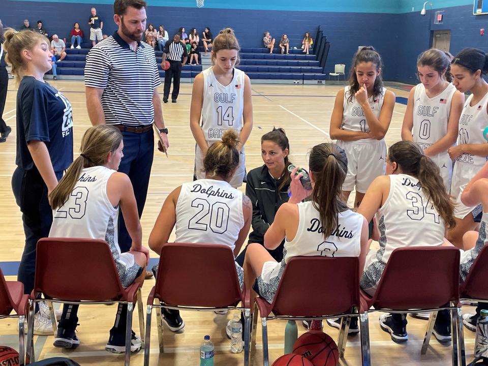 Gulf Breeze girls basketball head coach Tyger Paris talks to her team in a timeout during the 2021 Innisfree Hotels Beach Basketball Tournament on December 29, 2021 from the Gulf Breeze Recreational Center.