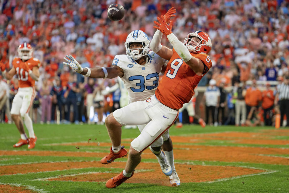 North Carolina linebacker Cedric Gray (33) breaks up a pass intended for Clemson tight end Jake Briningstool (9) during the first half of an NCAA college football game Saturday, Nov. 18, 2023, in Clemson, S.C. (AP Photo/Jacob Kupferman)