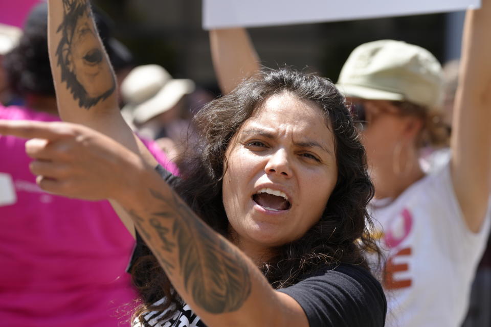 Abortion opponent Annie Wirth, center, shouts at abortion-rights supporters outside the South Carolina Statehouse on Thursday, July 7, 2022, in Columbia, S.C. Protesters clashed outside a legislative building, where lawmakers were taking testimony as they consider new restrictions on abortion in the wake of the U.S. Supreme Court's decision overturning of Roe v. Wade. (AP Photo/Meg Kinnard)