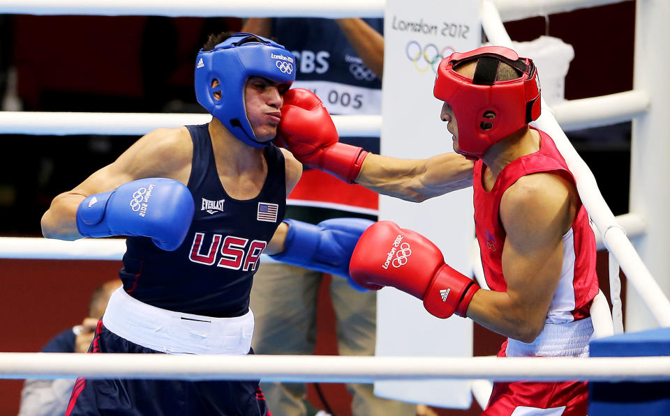 LONDON, ENGLAND - JULY 29: Jose Ramirez of United States (L) in action with Rachid Azzedine of France during their Men's Light (60kg) Boxing bout on day 2 of the London 2012 Olympic Games at ExCeL on July 29, 2012 in London, England. (Photo by Scott Heavey/Getty Images)