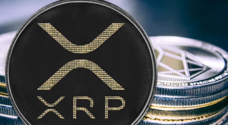 Coin cryptocurrency ripple on the background of a stack of coins