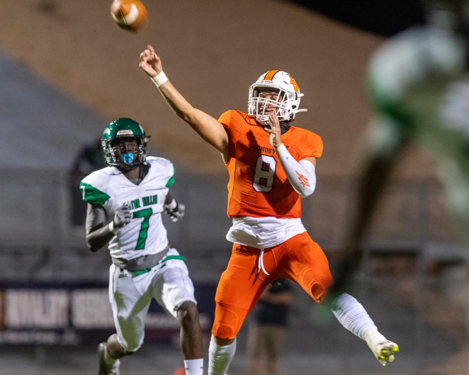 Apple Valley's Noah Celie throws a touchdown pass against Victor Valley during the 54th annual Bell Game on Friday, Sept. 8, 2023.