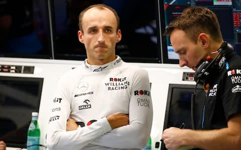 Polish Formula One driver Robert Kubica (L) of Williams in the team garage during the second practice session ahead of the Singapore Formula One Grand Prix in Singapore, 20 September 2019. The Singapore Formula One Grand Prix night race will take place on 22 September 2019. Singapore Formula One Grand Prix  - Credit: REX